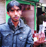 An employee of a dhaba, Vikas, who was injured in a firing on Monday night in Chanakyapuri in New Delhi on Tuesday.
