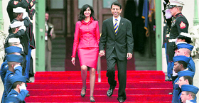 Louisiana Governor Bobby Jindal and wife Supriya descend the steps of the Old State Capitol to start inauguration ceremonies.
