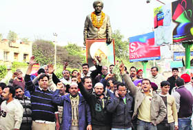 Former Chief Minister Beant Singh's grandson Amandeep Singh along with his supporters stage a dharna at BMC Chowk in Jalandhar on Tuesday.