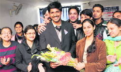 Ram Prasad Pemmasania celebrates his 100 percentile with co-students at his coaching centre in Chandigarh
