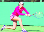 Nina Stojanovic of Serbia hits a return during her match at the CLTA courts in Sector 10 of Chandigarh