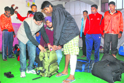 Members of the SFI help players from Kerala at the Government School in Sector 26 in Chandigarh