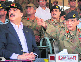 A file photo of Pakistan's Army Chief Gen Ashfaq Pervez Kayani (right) and Prime Minister Yousuf Raza Gilani. 