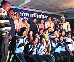 Winners of the National Baseball Championship strike a pose with the medals