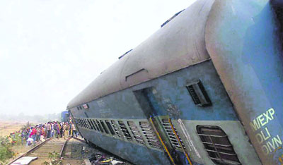 A derailed coach of the Delhi-bound Brahmaputra Mail that collided with a stationary goods train near Sahibganj on Wednesday . 