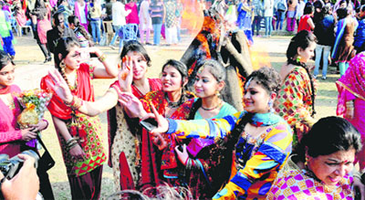 Students of MCMDAV College, Sector 36, Chandigarh, dance during the Lohri celebrations on the college campus on Thursday