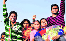 A woman candidate atop a truck coming after filing her nominations from Haridwar segment 