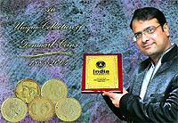 Neeraj Goyal shows his certificate issued by the India Book of Records for his unique collection of Denmark coins