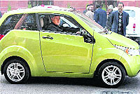 Union Minister for New and Renewable Energy Farooq Abdullah drives electric car Mahindra Reva NXR shortly before a Cabinet meeting in New Delhi on Thursday. The car is expected to be launched in the market this year