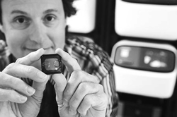Ion Torrent CEO and chairman Jonathan Rothberg holds a semiconductor sequencing chip that will be used in the new genome sequencing machine
