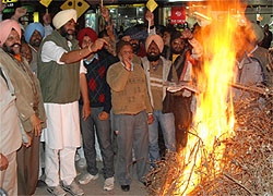 President of the PPP, Manpreet Singh Badal, lights a bonfire on Lohri in Bathinda on Friday