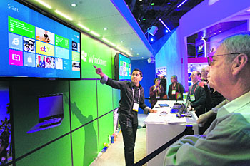Microsoft programme manager Chaitanya Sareen gives a demonstration of the Windows 8 operating system at the Microsoft booth at the 2012 International Consumer Electronics Show (CES) in Las Vegas, on Thursday. CES, the world's largest consumer technology tradeshow, runs through January 13.