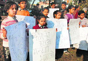 Children take part in a drive against Fiza in Mohali on Friday.