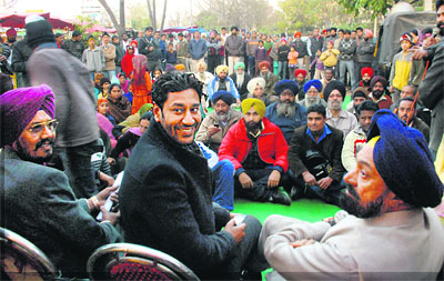 Punjabi singer Harbhajan Mann with SAD candidate Balwant Singh Ramoowalia at Mohali on Friday. 