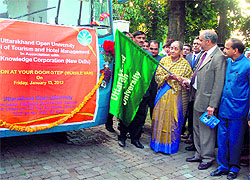 The Uttarakhand Governor flags off a mobile van of Uttarakhand Open University in Dehradun on Friday