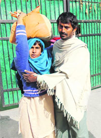 Mentally ill Rubina with her brother, Mushtaq, in Karnal.