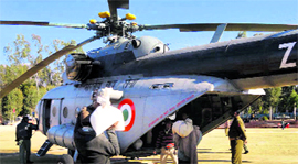 Relief material being loaded on to an IAF helicopter before being air-dropped in the snow-affected areas of Reasi on Friday.