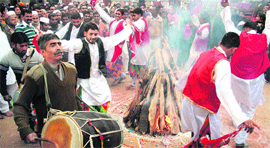 Inmates of District Jail Ambphalla celebrate Lohri in Jammu on Friday.