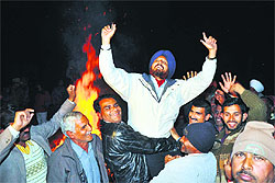 BSF officers and jawans celebrate Lohri at the Indo-Pak Border in Suchetgarh