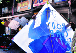 A youth sells a jumbo kite on the streets of Ludhiana 