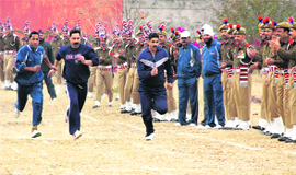 Employees take part in a race during the sports meet organised at the Central Jail in Jammu 