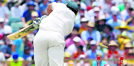 Ricky Ponting is bowled by Umesh Yadav in Perth on Saturday. Yadav was Indias most successful bowler claiming five wickets for 93 runs.