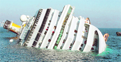 A luxury cruise ship Costa Concordia leans on its side after running aground the Tuscan island of Giglio, Italy, on Saturday. Water poured in through a 50-metre gash in the hull. While three persons were killed, 70 are reported missing and 4,200 persons were evacuated