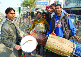 Happy days are here: Dholis play the instrument outside Sultanwind gate in Amritsar. 