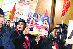 People demonstrate with placards in front of the headquarters of Standard & Poor's on Saturday in Paris, with the placard in the centre reading "Profits increase, precariousness as well". The possibility of a breakup of the eurozone was not a key factor in a series of ratings changes and downgrades of bloc members, including top rated France, S&P said. The ratings agency downgraded the sovereign debt ratings of nine of the eurozone's 17 member states on Friday and said it was disappointed the European Central Bank had not stepped up its purchases of the bloc's bonds in the secondary market to calm investors