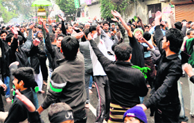 Shia community members perform matam in a procession being taken out on the occasion of Chellum in Dehradun on Sunday.