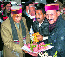 Irrigation Minister Ravinder Ravi welcomes Chief Minister Prem Kumar Dhumal as he arrives for his winter sojourn in Dharamsala on Sunday evening