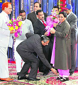 A supporter of UP CM Mayawati seeks her blessings during her 56th birthday celebrations.