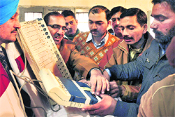Poll staff being trained about the use of the EVM in Jalandhar on Sunday. 