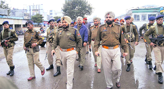 The police along with paramilitary forces takes out a flag march in Jalandhar on Sunday.