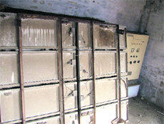 Non-functional and broken solar lights lying in a room.