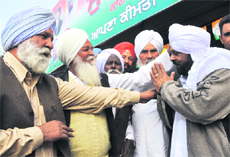 Congress' Mohd Sadiq (extreme right) canvasses at Tapa village