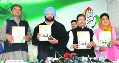 (From left) BK Hariprasad, AICC general secretary, Capt Amarinder Singh, PCC chief, GS Charak and Rajinder Kaur Bhattal at the release of the party manifesto at Punjab Congress Bhawan in Chandigarh on Sunday. 