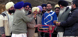 Former DGP and SAD candidate Paramdeep Singh Gill while canvassing at Saleena village in Moga.