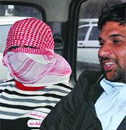 Bakarwala, wanted for 500 cases of vehicle theft, is produced in the Tis Hazari Court, New Delhi, on Monday. 