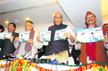 Senior BJP leader Rajnath Singh and Chief Minister BC Khanduri, along with other leaders, release the election manifesto in Dehradun on Monday. 
