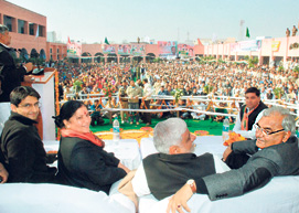 Chief Minister Bhupinder Singh Hooda and other Congress leaders on dais during a public meeting in Jhajjar.