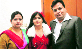Prakriti Chandra (centre) with her parents in Jammu on Monday.