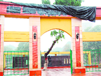 The name of the park and (below) SAD leaders statue have been covered up in Amritsar