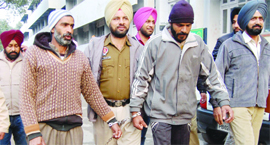 Rashid Ahmed and Shaukat Ali in police custody in Amritsar on Tuesday.