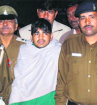 The accused Rahul in police custody in Chandigarh on Tuesday