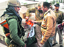 Officials of the election office seize posters from a vehicle in Phases I and II of Mohali on Tuesday