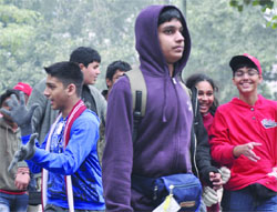 Children wrapped in warm woollens clothes on a cold morning in New Delhi on Tuesday.
