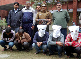 The five accused in police custody for their involvement in a petrol pump robbery at Faridabad. 