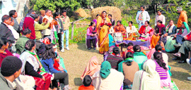 Amrita Rawat, Congress candidate from the Ramnagar Assembly segment, addresses villagers during her election campaign on Tuesday.