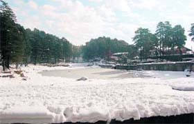 Dal Lake, about 25 km from Dharamsala, wears a white mantle